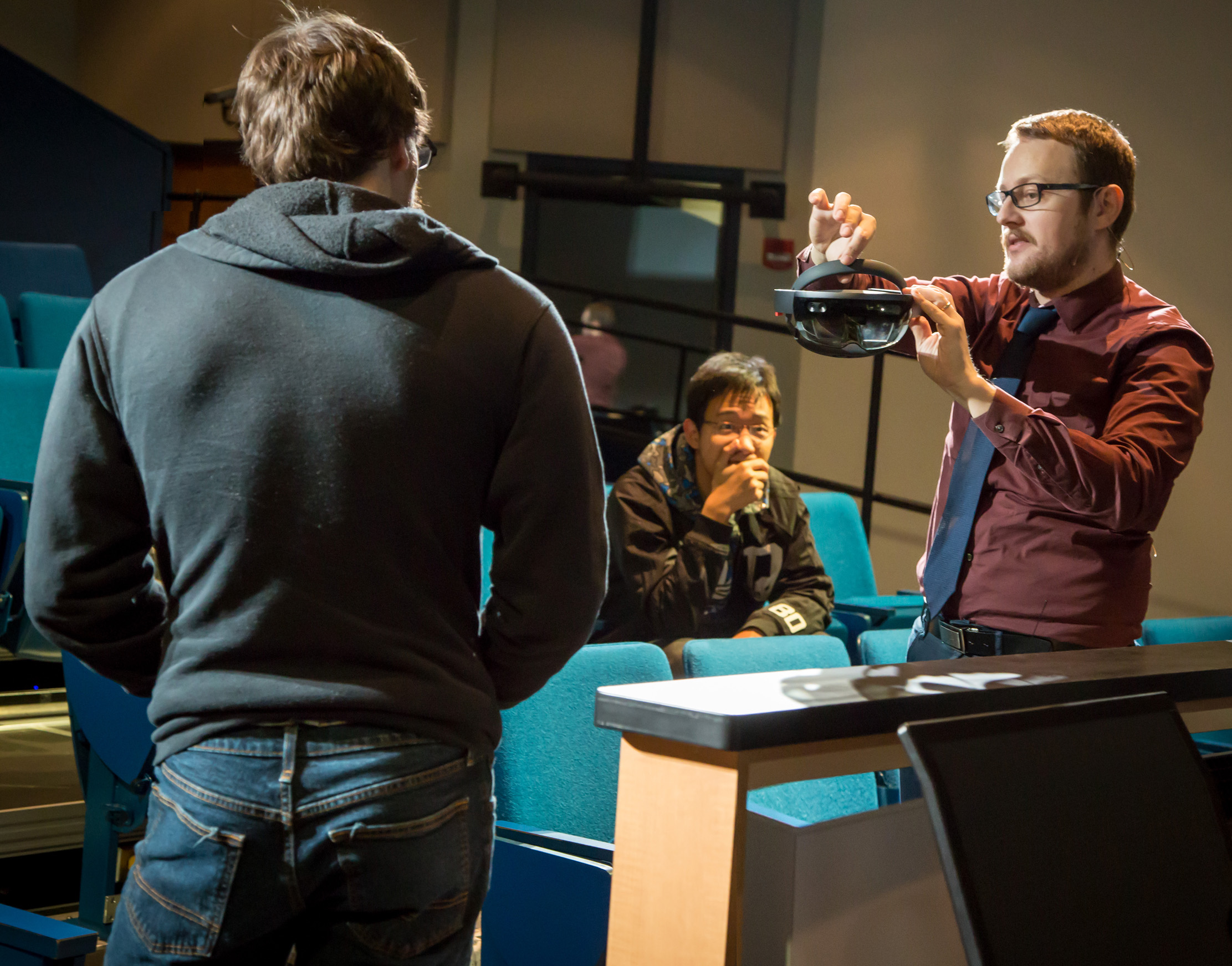 Researcher using a mixed reality headset in a digital studio environment